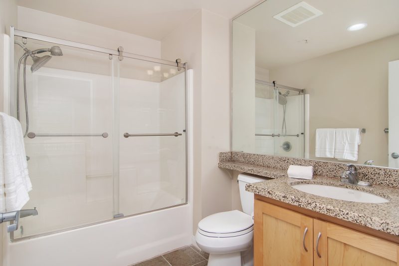 Combined shower-bathtub in the master bathroom.