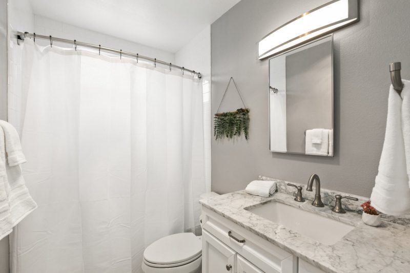 View of the bathroom with a combined shower-bathtub.