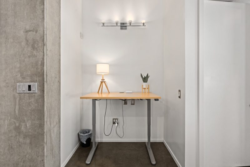 Work nook with an electric, adjustable desk.