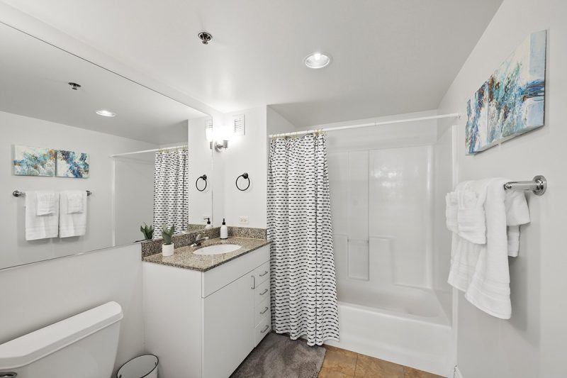 Bathroom with a combined bathtub-shower.