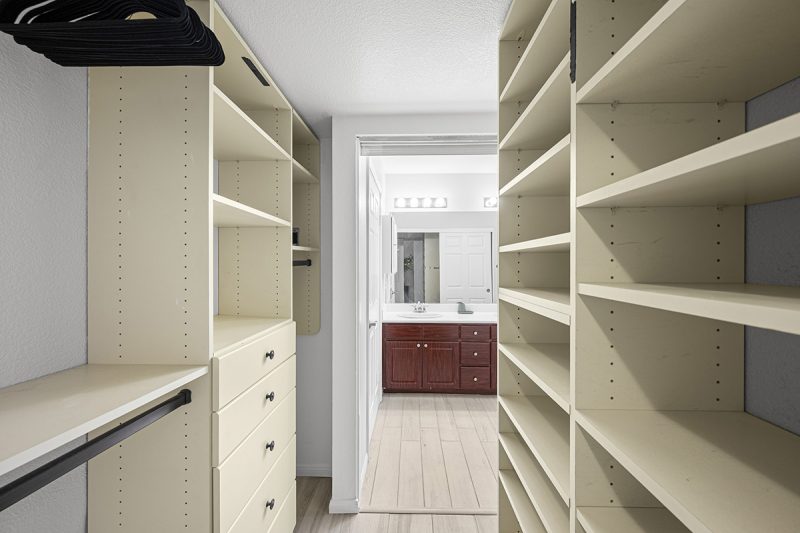 Primary bedroom walk-in closet.