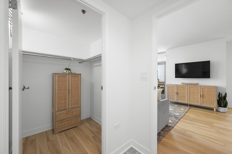 View of the primary bedroom walk-in closet.