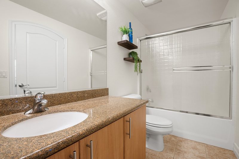 View of the primary bathroom with a combination shower-bathtub.