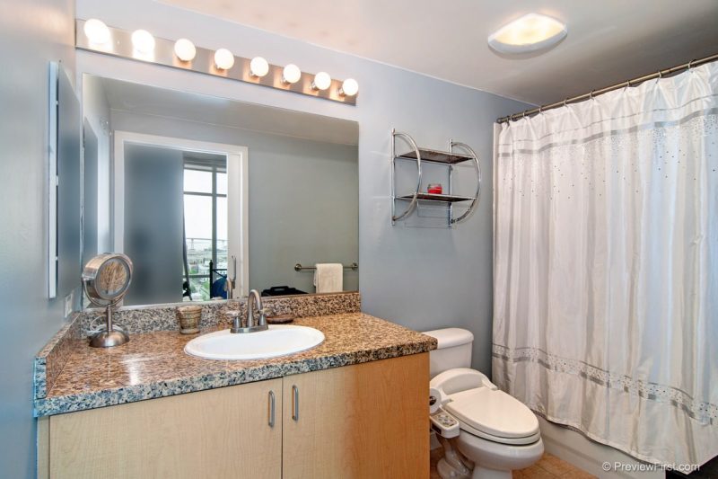 Combined shower-bathtub in the master bathroom.