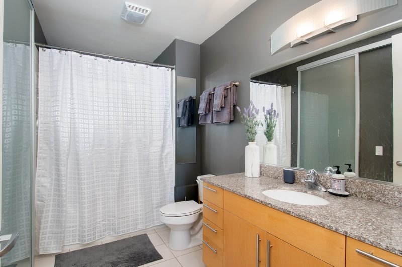 Master bathroom with shower-bathtub combo and walk-in closet.