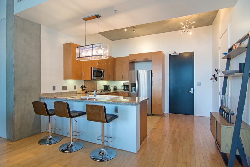 Barstools at the kitchen counter provide seating for three.
