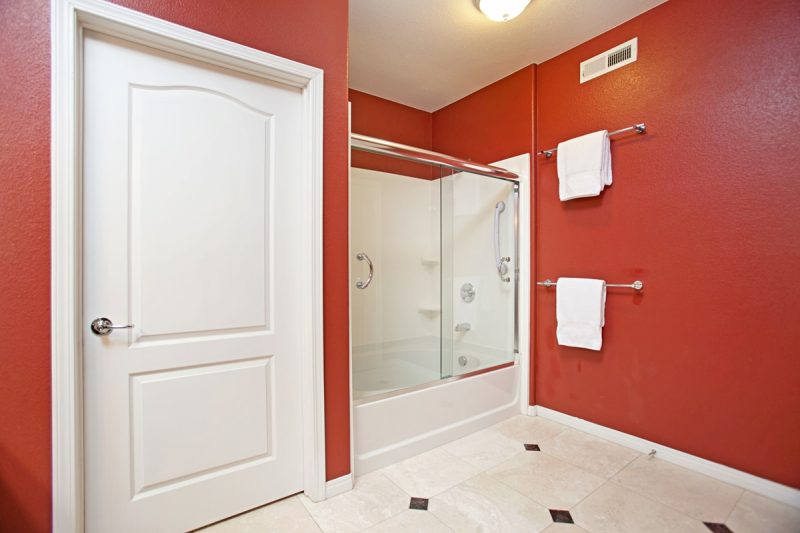 Master bathroom with large bathtub-shower combination.