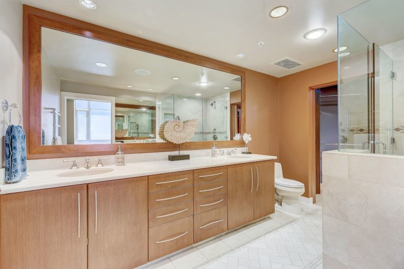 Primary bathroom with a dual sink vanity vounter.