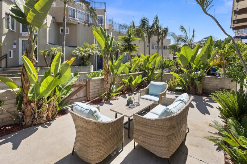 Sunny community patio with comfortable lounge furniture.