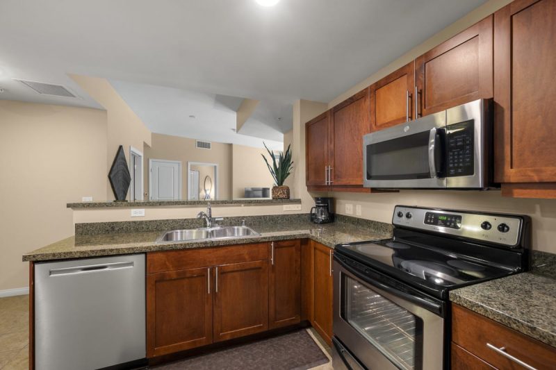 Roomy kitchen with stainless steel appliances.