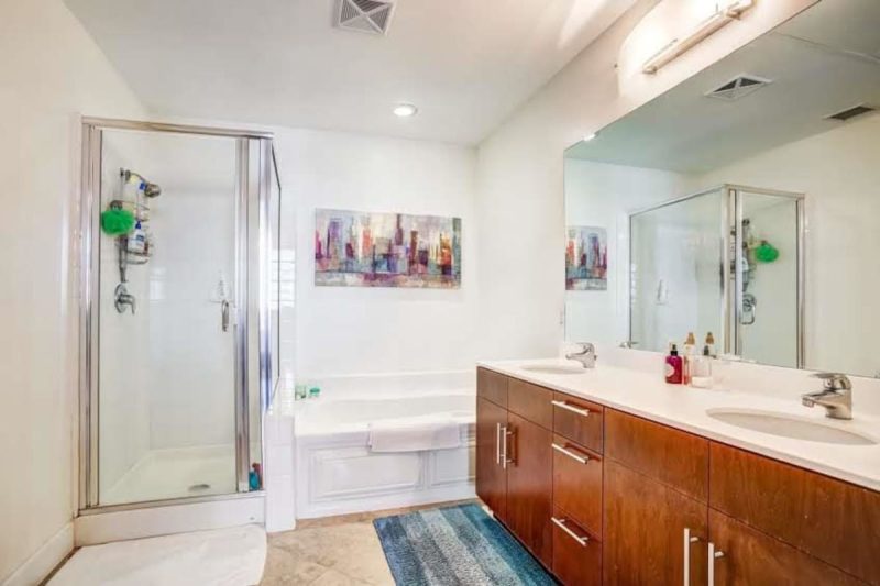 Master bathroom with walk-in shower and freestanding bathtub.