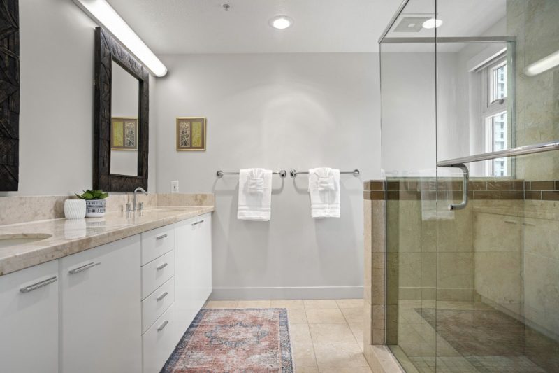 Walk-in shower and dual sinks in the master bathroom.