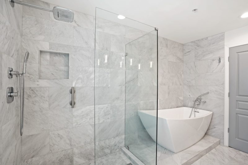 Luxurious walk-in shower and free-standing bathtub in the master bathroom.